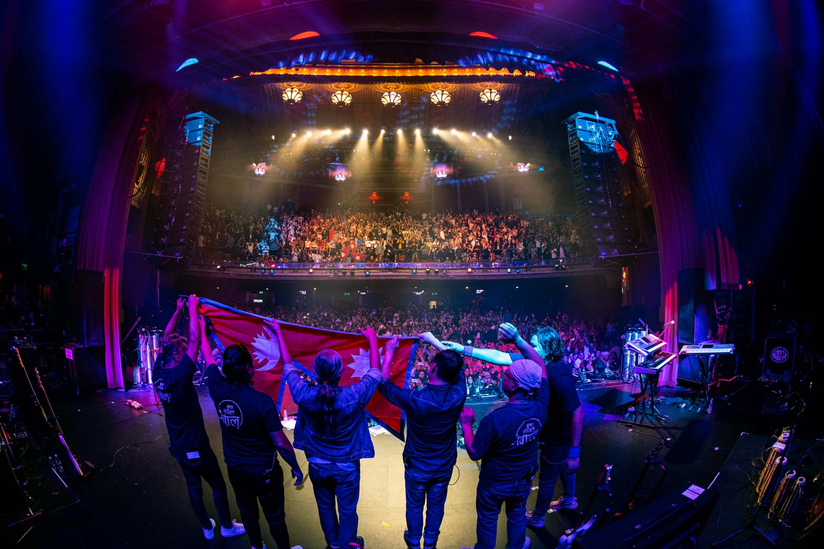 03-Nepathya-members-raising-the-national-flag-during-their-performance-in-San-Francisco.-Photo-Dipit-Raz-1723474101.jpg